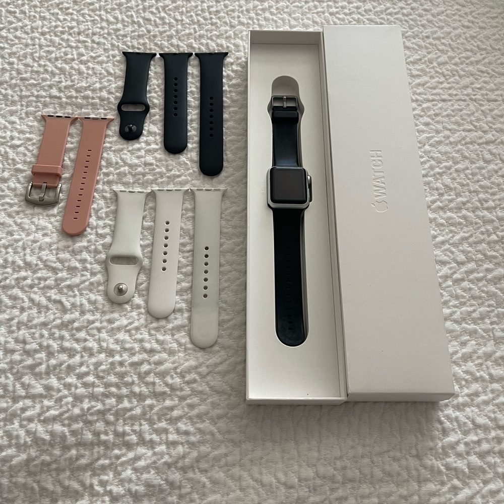 Apple Watch Series 1.  38mm Silver Aluminum Case w Black, Pink, and White Bands